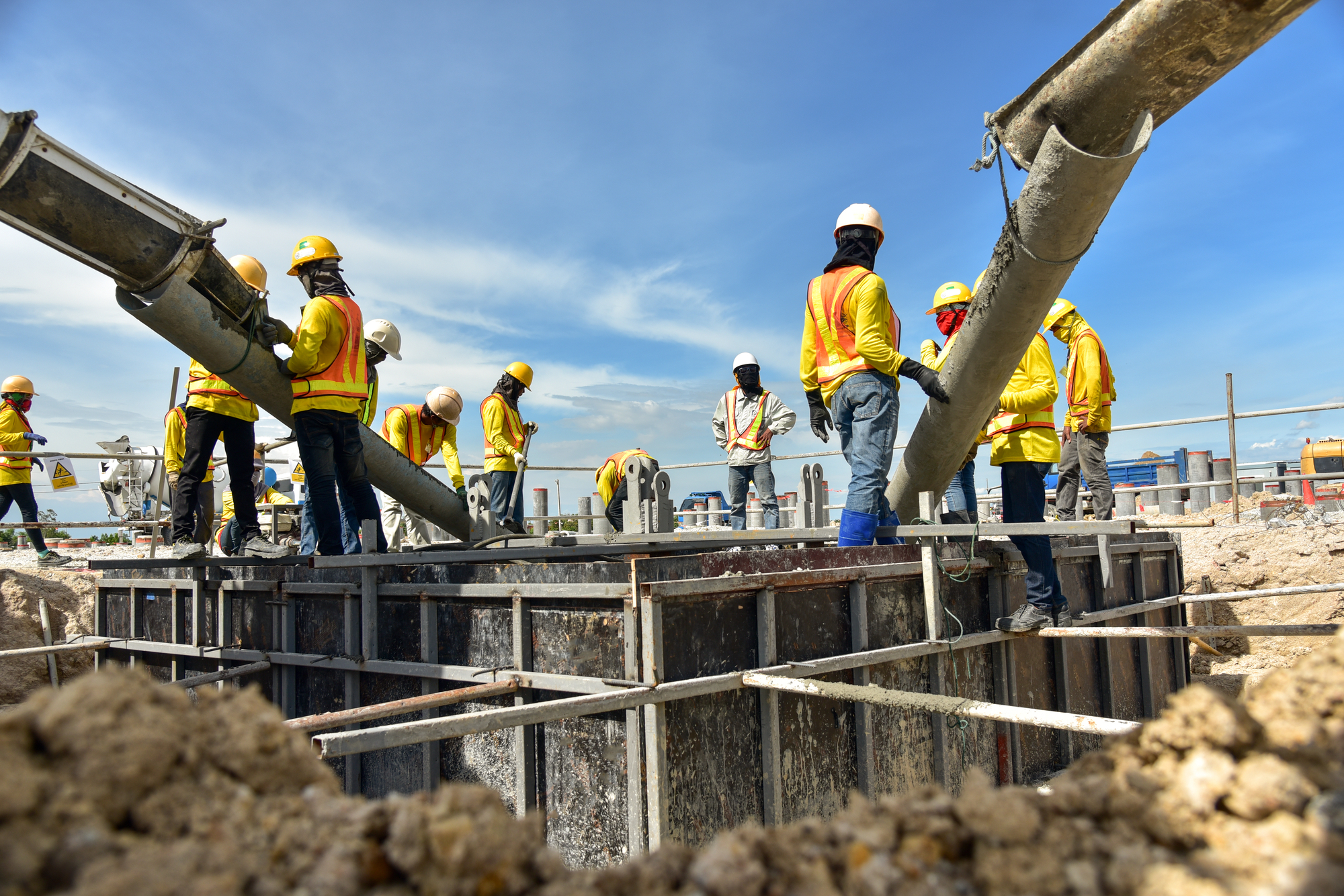 A Group Of Construction Workers Working On A Construction Site
